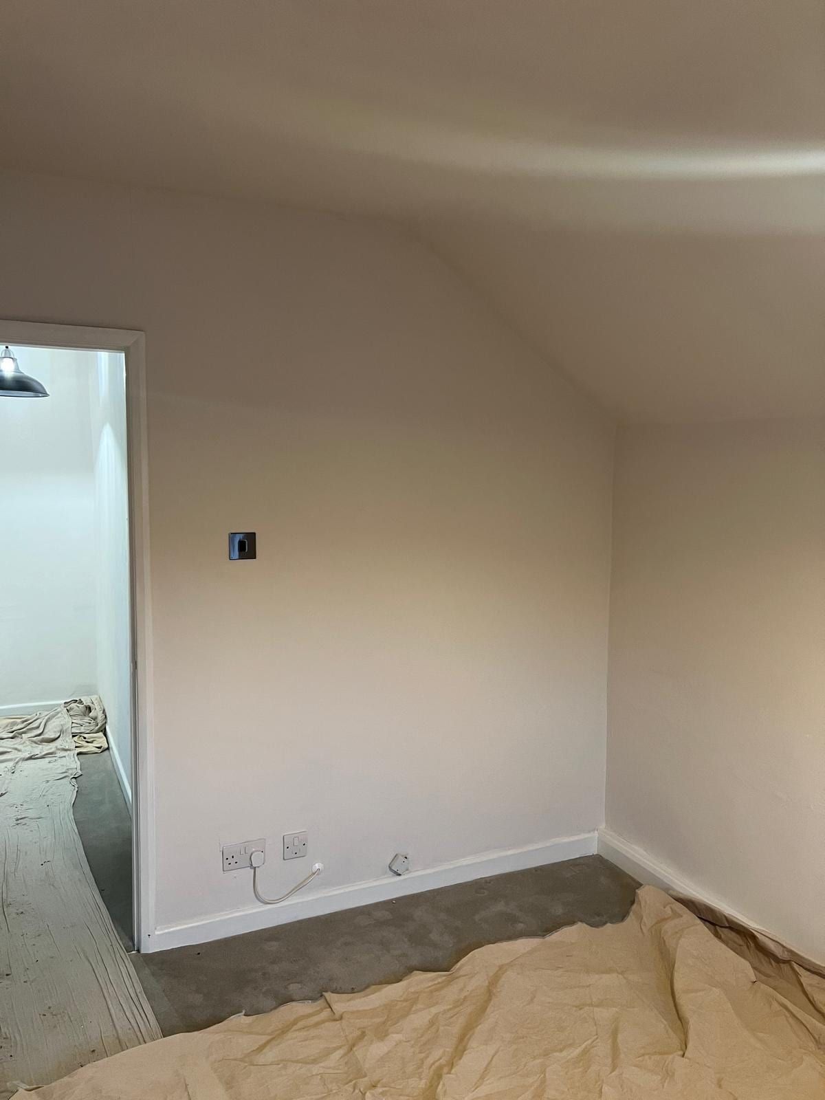 The Loughborough bedroom before: an empty corner under the sloping ceiling