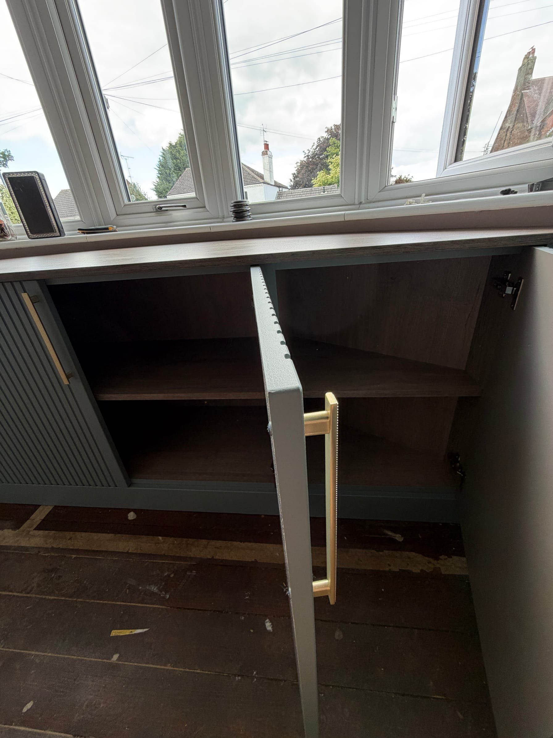 One of the Sileby bay window units open, showing the storage inside